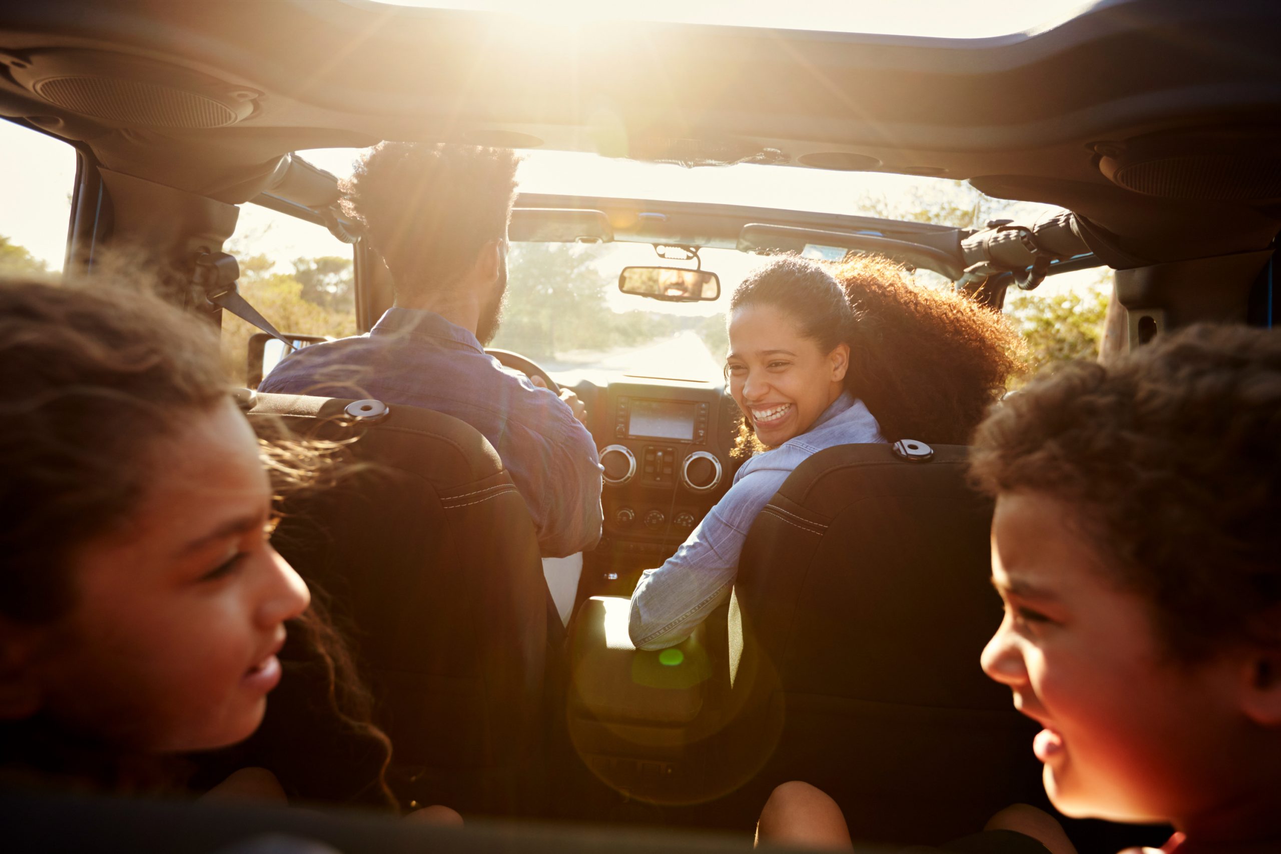 Mom chatting with kids in car. Car hacks for moms.