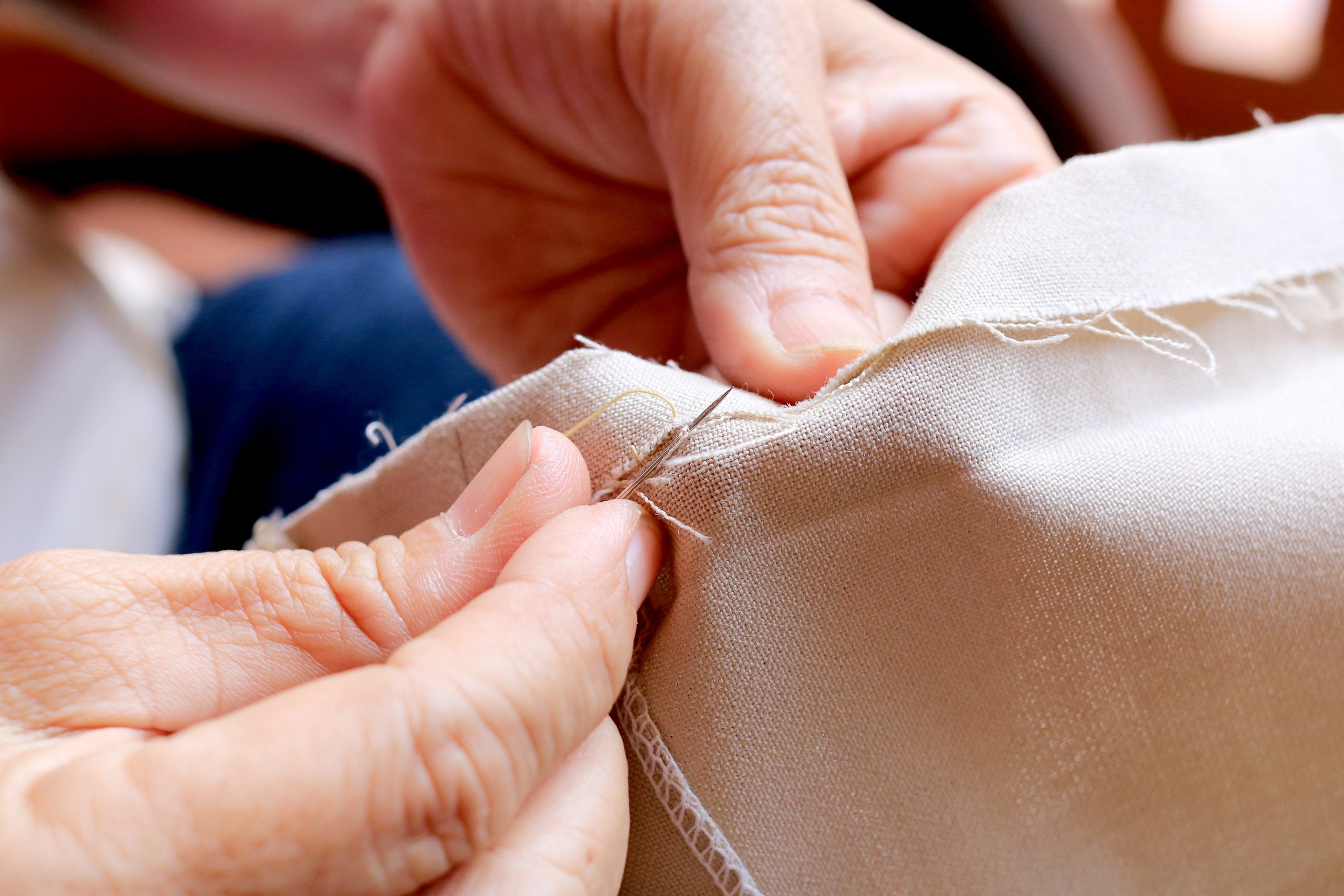 hand sewing a edge on fabric