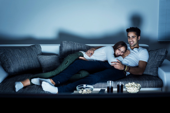 Young couple watching TV