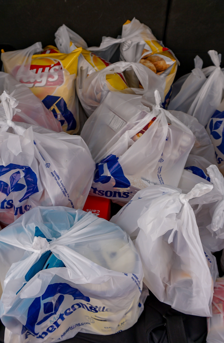 It can be tricky finding ways to store plastic bags. If you're a soda lover, try using an empty 2 liter bottle to keep them in. 