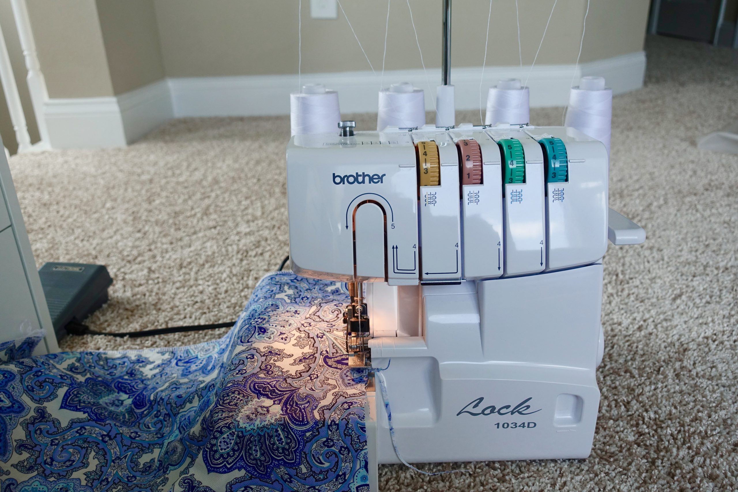 Adjusting the tension on a serger is one of the serger hacks mentioned in this article.