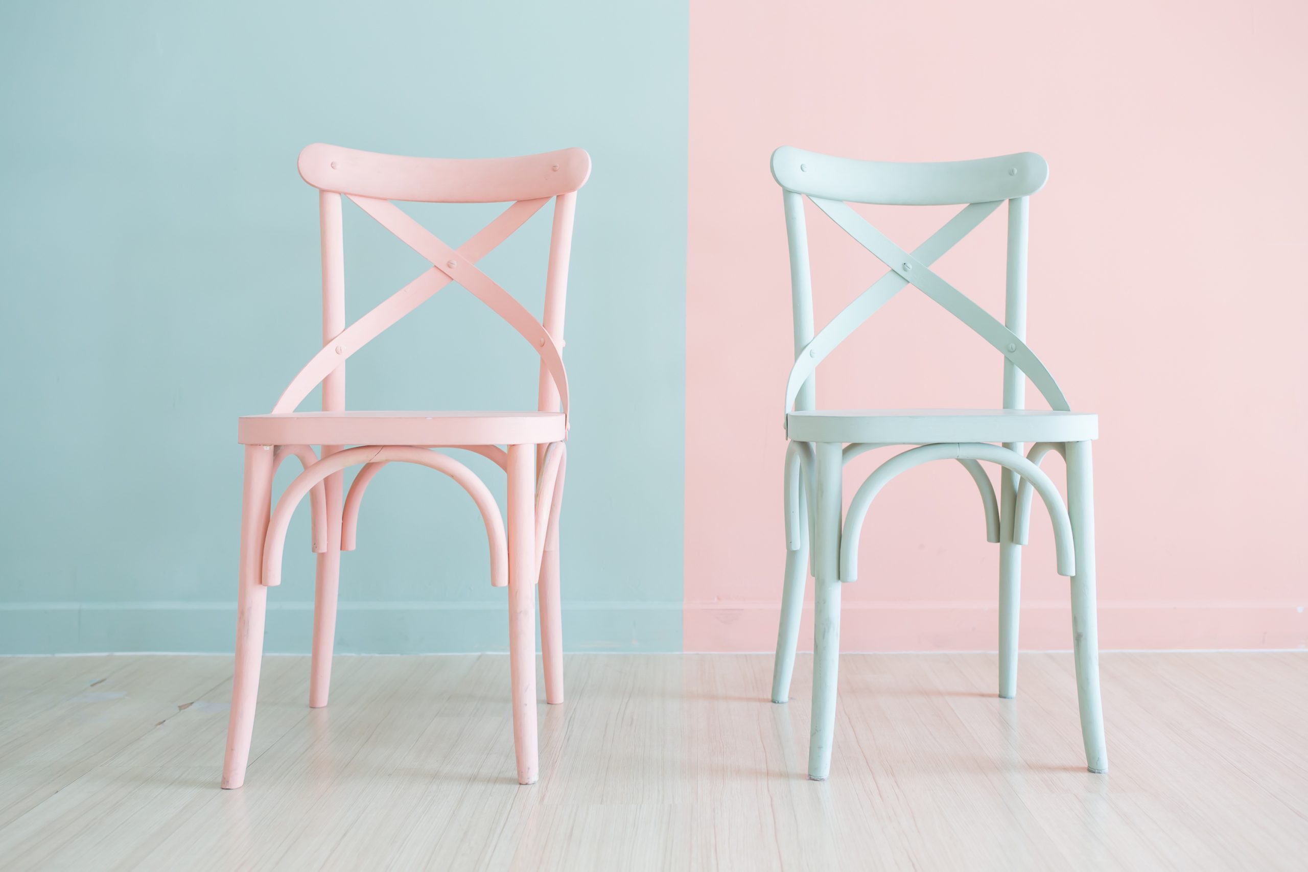 Two chairs that have been spray painted. Learn how to spray paint furniture in this article.