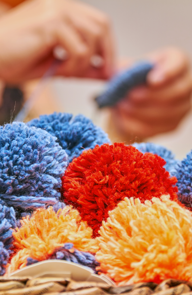 Keep your home organized and totally stylish with this easy tutorial for a boho DIY basket with pom poms. Believe it or not, this is such an easy DIY project that you could make more than one in no time at all. And the best part is, they're totally customizable! 